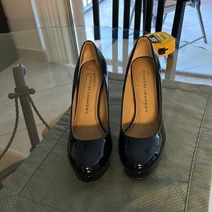 Black patent leather shoes, four and three-quarter inch heel. Chinese Laundry